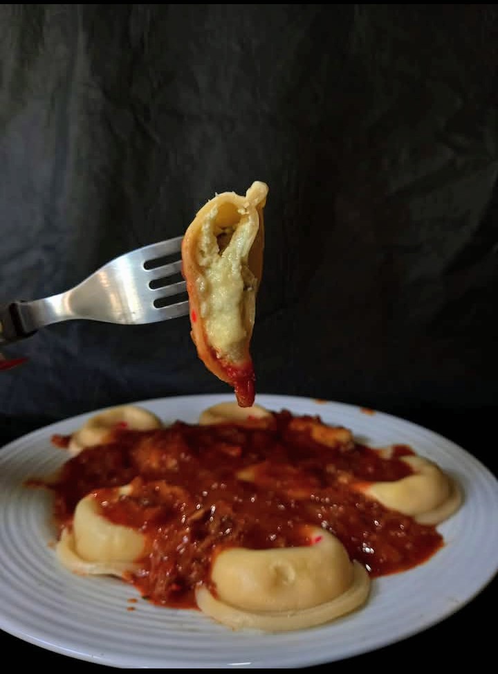 Sorrentinos con salsa bolognesa